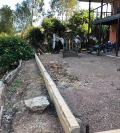 Retaining wall replacement and turf