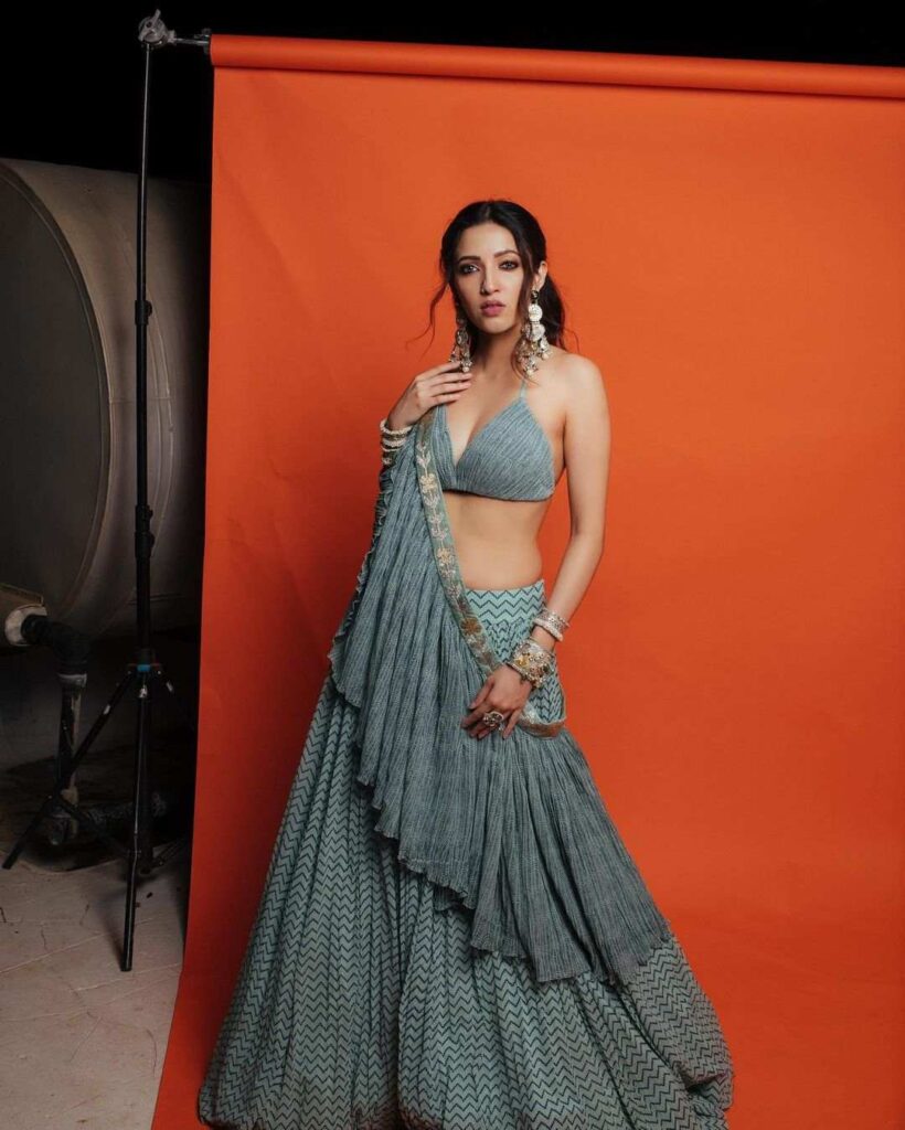 Neha Shetty in a blue pre-draped lehenga by Pooja Rajgarhia Gupta